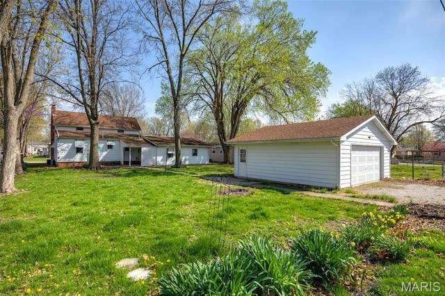 204 E 3rd N St, Mount Olive, IL 62069 - view of green lawn featuring an outbuilding and a garage