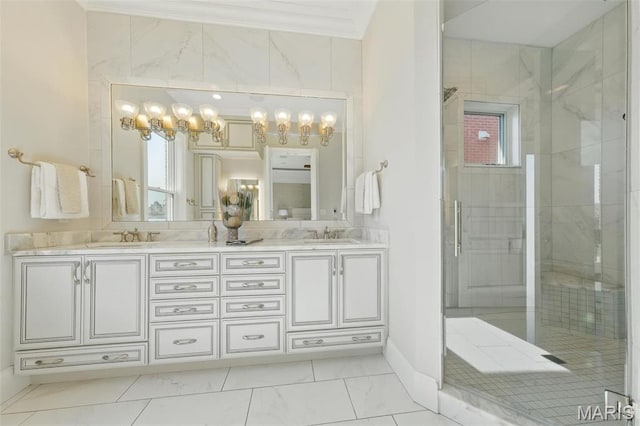 1212 Dolman St, Saint Louis, MO 63104 - full bathroom featuring double vanity, a stall shower, crown molding, marble look tile flooring, and plenty of natural light