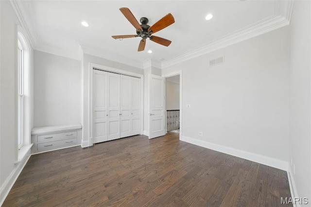 1212 Dolman St, Saint Louis, MO 63104 - unfurnished bedroom with dark wood finished floors, crown molding, baseboards, a closet, and recessed lighting