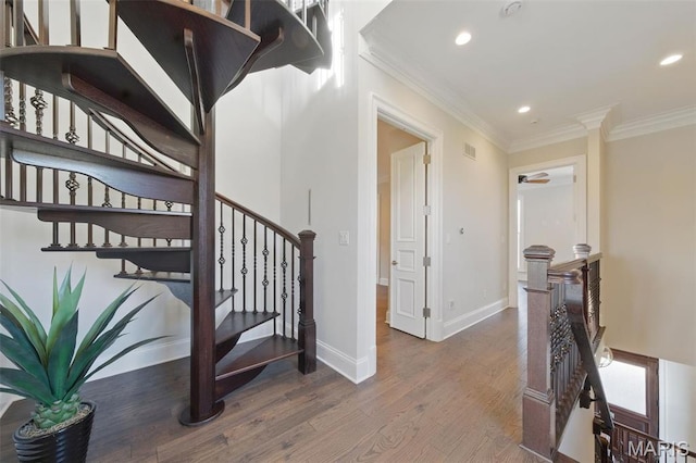 1212 Dolman St, Saint Louis, MO 63104 - stairway with ornamental molding, recessed lighting, wood finished floors, baseboards, and ceiling fan