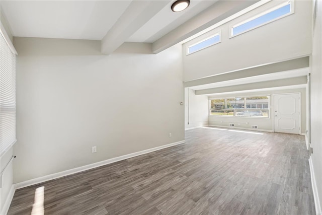7921 Glenside Pl, Saint Louis, MO 63130 - empty room with a towering ceiling, wood finished floors, and baseboards