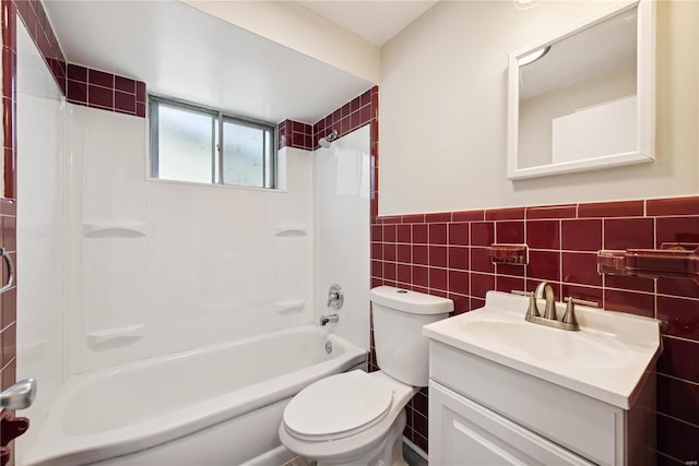 7921 Glenside Pl, Saint Louis, MO 63130 - full bathroom featuring tile walls, toilet, wainscoting, vanity, and bathtub / shower combination