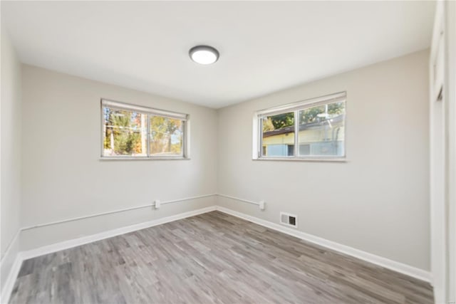 7921 Glenside Pl, Saint Louis, MO 63130 - unfurnished room featuring wood finished floors and baseboards
