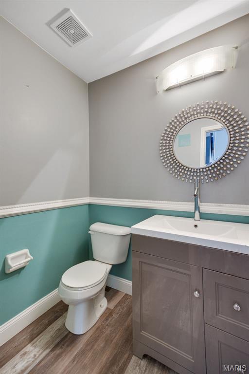 1008 Baypointe Dr, Imperial, MO 63052 - bathroom with vanity and wood finished floors
