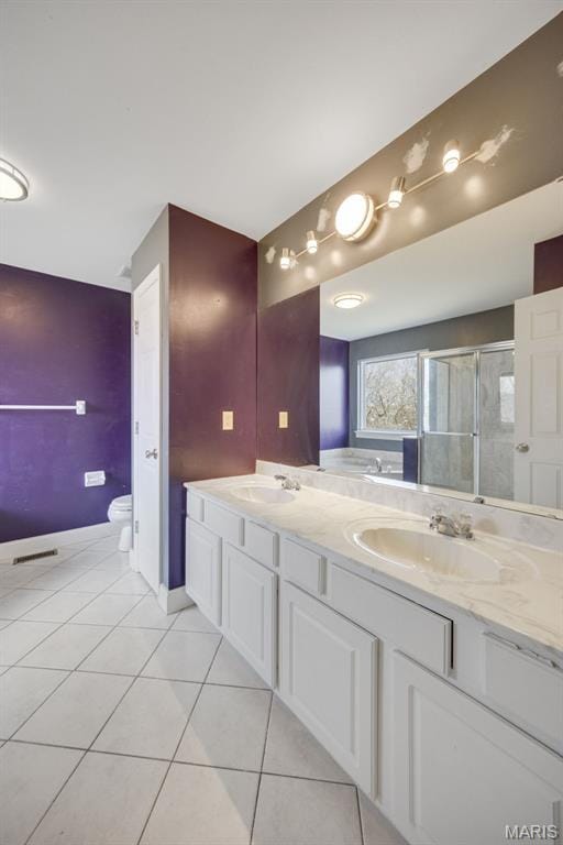 1008 Baypointe Dr, Imperial, MO 63052 - bathroom featuring tile patterned flooring, double vanity, and a shower stall