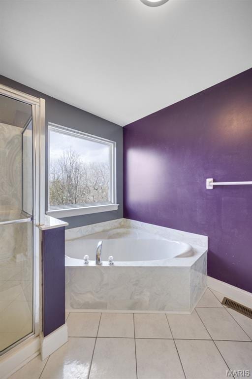 1008 Baypointe Dr, Imperial, MO 63052 - bathroom featuring a bath, tile patterned floors, and a stall shower