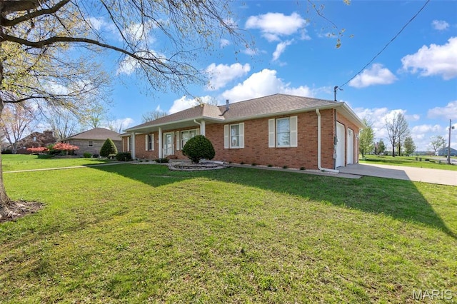 413 Huber Rd, Perryville, MO 63775 - ranch-style house with brick siding, an attached garage, driveway, and a front yard