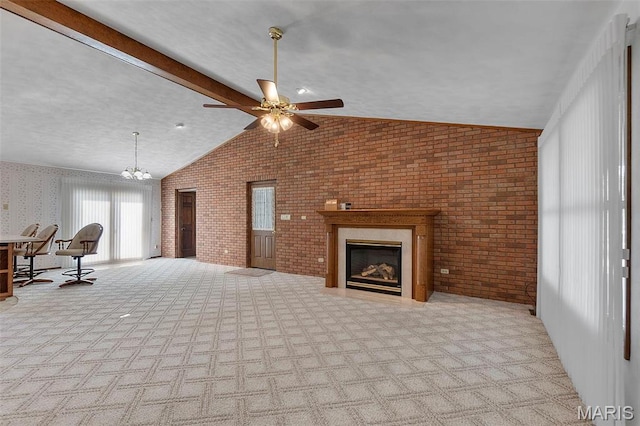 413 Huber Rd, Perryville, MO 63775 - unfurnished living room featuring brick wall, lofted ceiling, carpet flooring, a glass covered fireplace, and a ceiling fan