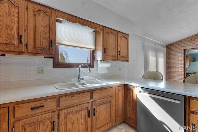 413 Huber Rd, Perryville, MO 63775 - kitchen featuring dishwasher, a sink, brown cabinetry, lofted ceiling, and wallpapered walls
