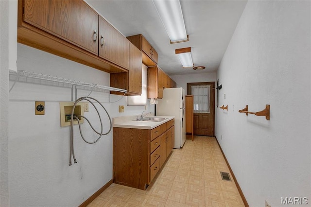413 Huber Rd, Perryville, MO 63775 - laundry room with hookup for a washing machine, cabinet space, light floors, and baseboards