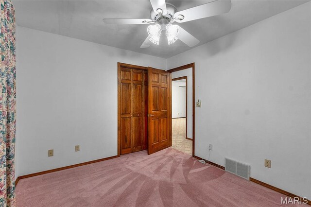 413 Huber Rd, Perryville, MO 63775 - unfurnished bedroom featuring light carpet, baseboards, and ceiling fan