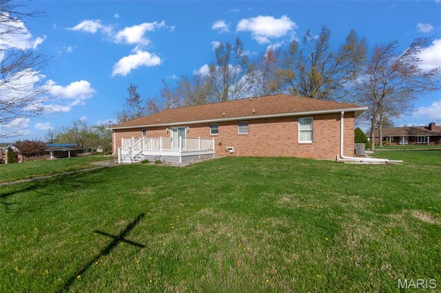 413 Huber Rd, Perryville, MO 63775 - rear view of house featuring a wooden deck, a yard, and brick siding