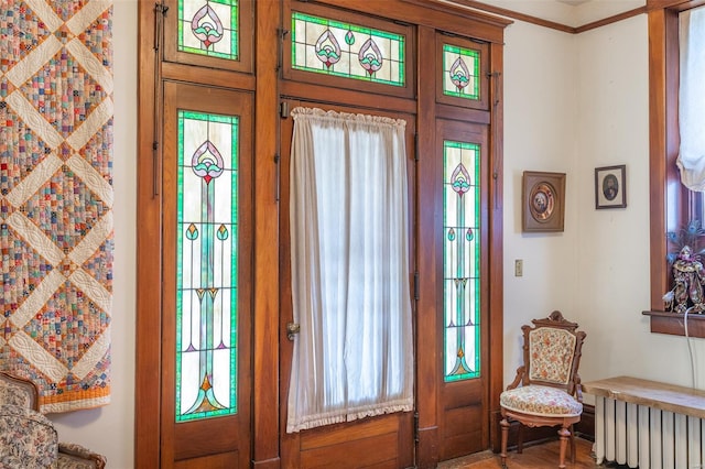 doorway to outside featuring radiator heating unit