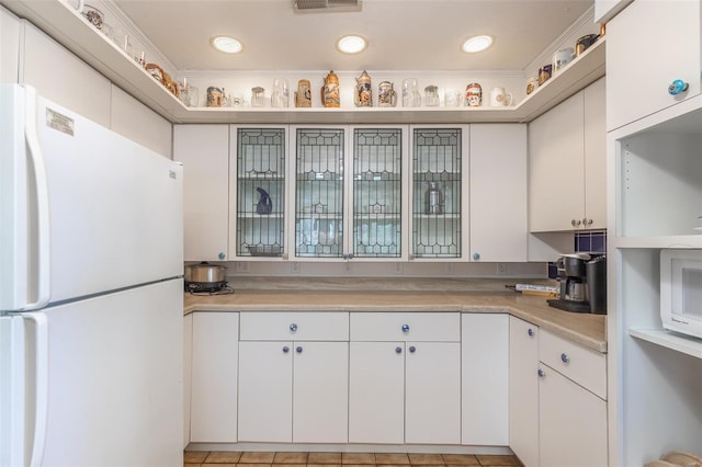 kitchen featuring white appliances, light countertops, white cabinets, recessed lighting, and open shelves