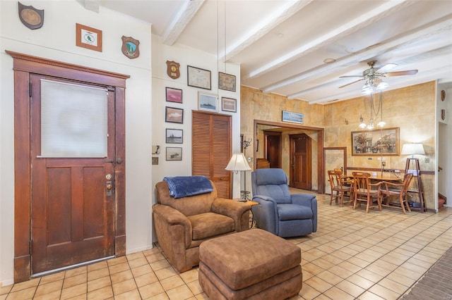living room with light tile patterned floors, beamed ceiling, and a ceiling fan