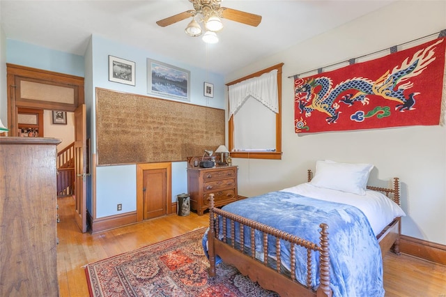 bedroom with wood finished floors and a ceiling fan