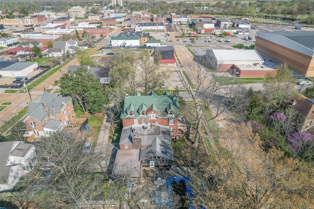 aerial view of property and surrounding area with nearby suburban area