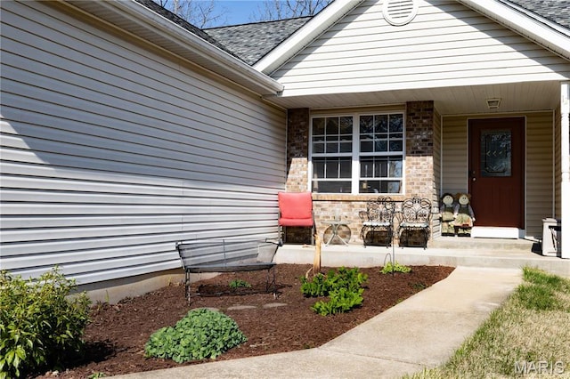 12 Sumter Dr, Hillsboro, MO 63050 - doorway to property featuring covered porch and roof with shingles