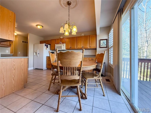 12 Sumter Dr, Hillsboro, MO 63050 - dining room with light tile patterned flooring, baseboards, and a chandelier
