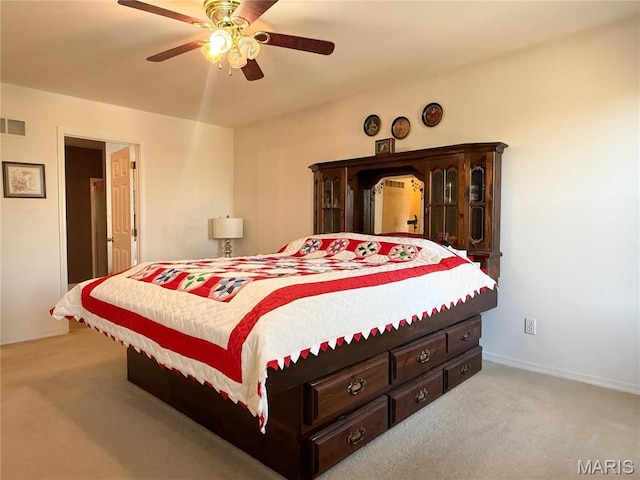 12 Sumter Dr, Hillsboro, MO 63050 - bedroom with light colored carpet, baseboards, and ceiling fan