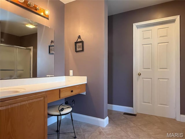 12 Sumter Dr, Hillsboro, MO 63050 - full bathroom with a shower stall, vanity, tile patterned floors, and baseboards