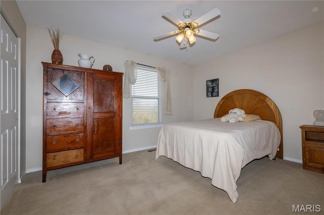 12 Sumter Dr, Hillsboro, MO 63050 - bedroom with light carpet, baseboards, a ceiling fan, and a closet