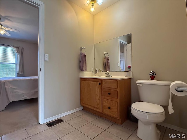 12 Sumter Dr, Hillsboro, MO 63050 - bathroom featuring tile patterned floors, vanity, ensuite bath, ceiling fan, and toilet