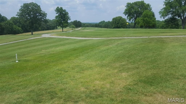 12 Sumter Dr, Hillsboro, MO 63050 - view of property's community featuring a lawn, golf course view, and view of wooded area
