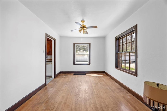 1825 S New Florissant Rd, Florissant, MO 63031 - empty room featuring baseboards, light wood-style floors, and ceiling fan
