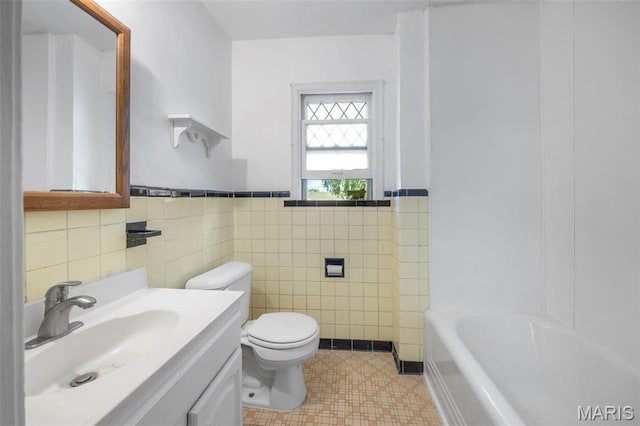 1825 S New Florissant Rd, Florissant, MO 63031 - full bath with tile walls, toilet, vanity, and a wainscoted wall