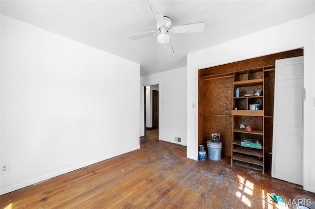 1825 S New Florissant Rd, Florissant, MO 63031 - unfurnished bedroom with hardwood / wood-style floors, baseboards, and ceiling fan