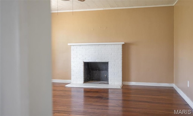 406 Locust St, Richland, MO 65556 - detailed view of wood finished floors, a fireplace, baseboards, and ornamental molding