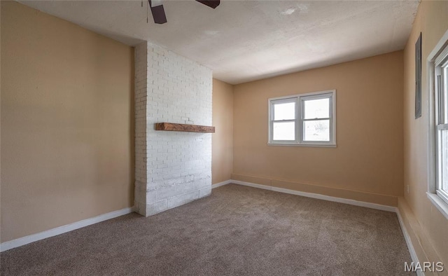 406 Locust St, Richland, MO 65556 - carpeted empty room with a ceiling fan and baseboards