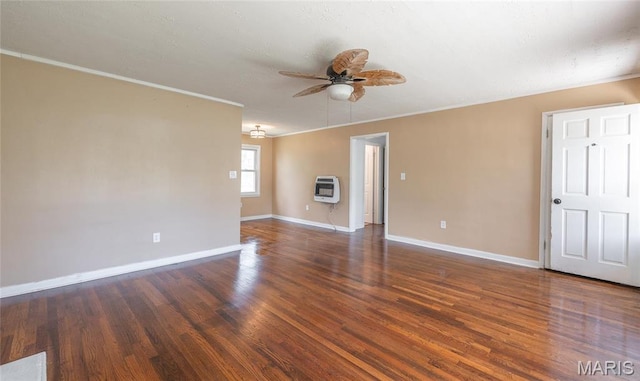 406 Locust St, Richland, MO 65556 - spare room featuring heating unit, ceiling fan, wood finished floors, baseboards, and crown molding