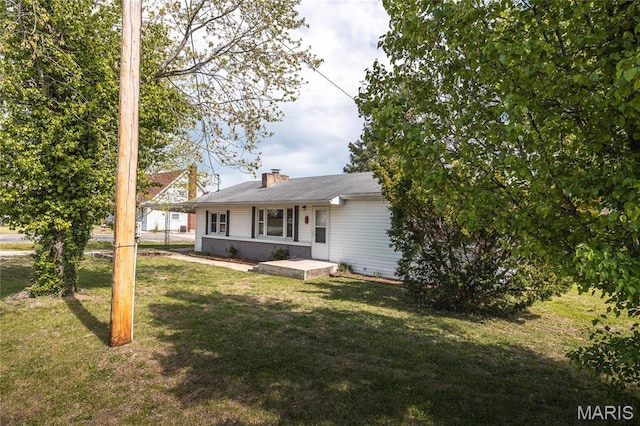 406 Locust St, Richland, MO 65556 - back of house with a yard and a chimney