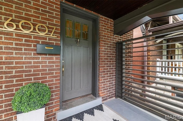 6007 S Kingshighway Blvd S, Saint Louis, MO 63109 - doorway to property with brick siding