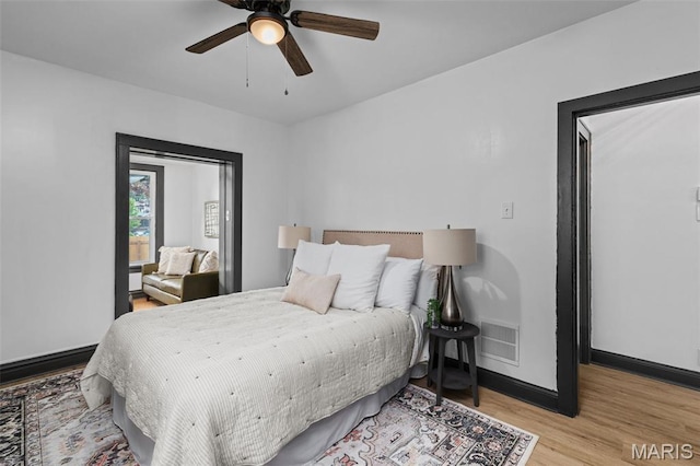 6007 S Kingshighway Blvd S, Saint Louis, MO 63109 - bedroom featuring wood finished floors, baseboards, and a ceiling fan