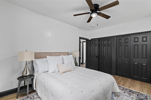 6007 S Kingshighway Blvd S, Saint Louis, MO 63109 - bedroom featuring wood finished floors, ceiling fan, and baseboards