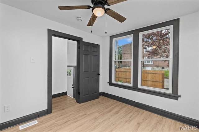 6007 S Kingshighway Blvd S, Saint Louis, MO 63109 - unfurnished room with light wood-style floors, baseboards, a ceiling fan, and a smoke detector