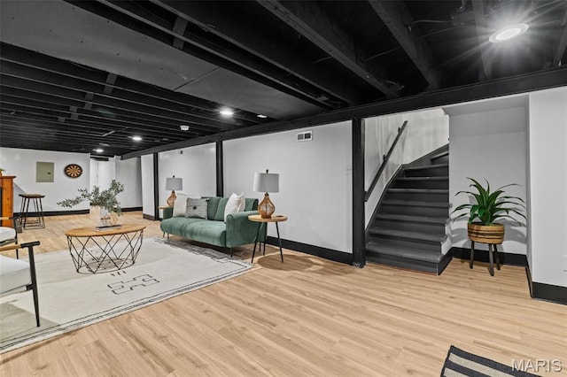 6007 S Kingshighway Blvd S, Saint Louis, MO 63109 - living room with baseboards, stairway, and wood finished floors