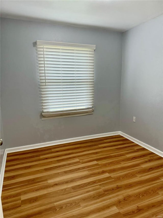 4400 Mohegan Dr, Saint Louis, MO 63123 - unfurnished room with light wood-style floors and baseboards