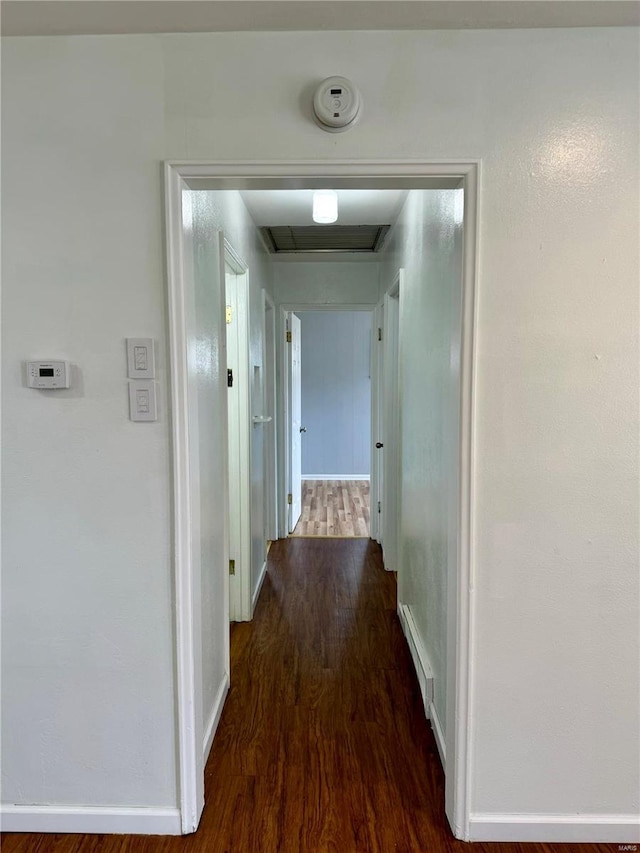 4400 Mohegan Dr, Saint Louis, MO 63123 - hall with dark wood-type flooring and baseboards