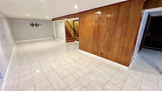 4400 Mohegan Dr, Saint Louis, MO 63123 - unfurnished room with stairway, recessed lighting, light marble finish flooring, baseboards, and wooden walls