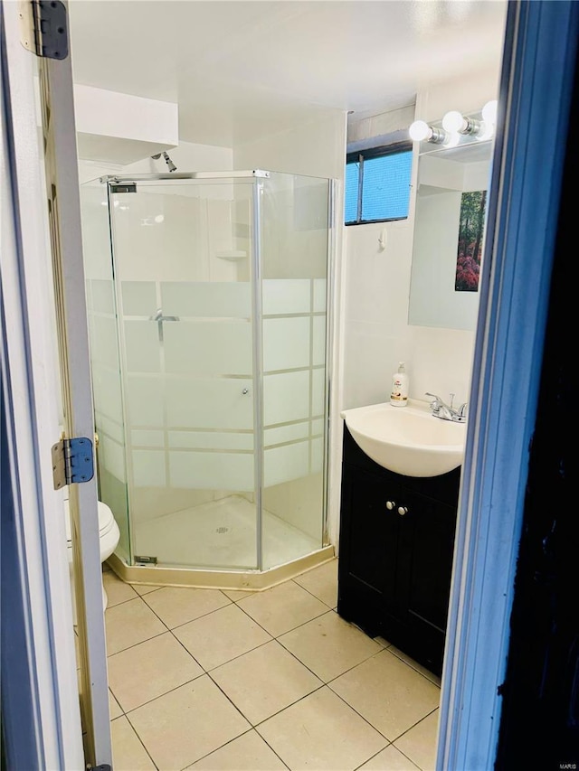 4400 Mohegan Dr, Saint Louis, MO 63123 - full bathroom with tile patterned floors, vanity, a shower stall, and toilet