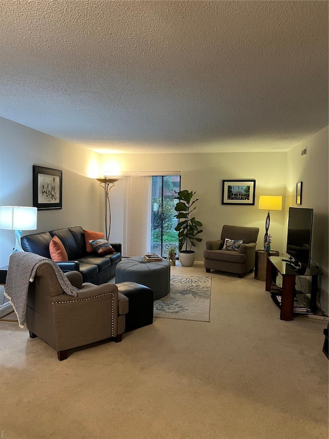 572 Coeur De Royale Unit 103, Creve Coeur, MO 63141 - carpeted living room featuring a textured ceiling