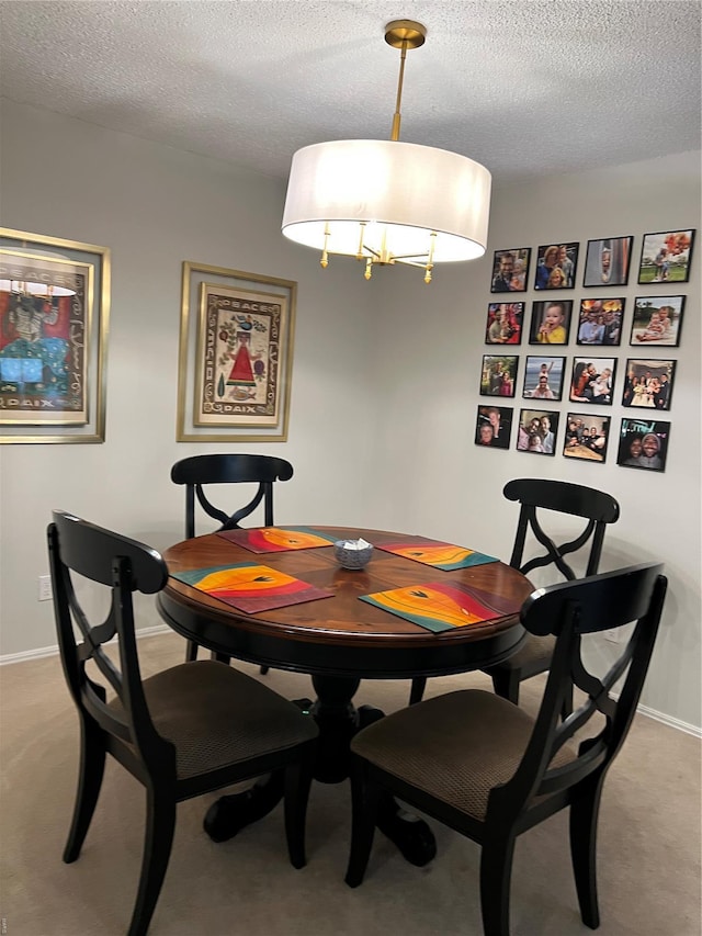 572 Coeur De Royale Unit 103, Creve Coeur, MO 63141 - dining area with a textured ceiling, baseboards, and light colored carpet