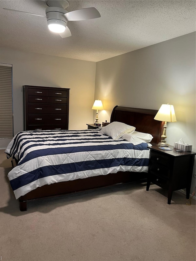 572 Coeur De Royale Unit 103, Creve Coeur, MO 63141 - carpeted bedroom featuring a textured ceiling and ceiling fan