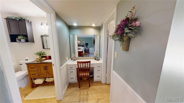 705 Linder Blvd, Greenville, IL 62246 - bathroom featuring wood finished floors, vanity, and toilet