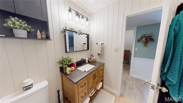 705 Linder Blvd, Greenville, IL 62246 - bathroom featuring vanity, wood finished floors, and toilet
