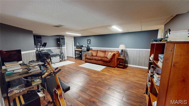 705 Linder Blvd, Greenville, IL 62246 - office area with a wainscoted wall, wood finished floors, and a textured ceiling